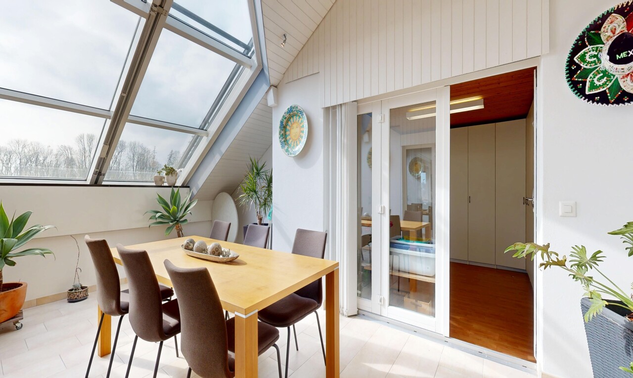dining area featuring vaulted ceiling