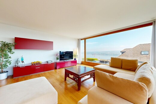 living room with light wood finished floors and floor to ceiling windows