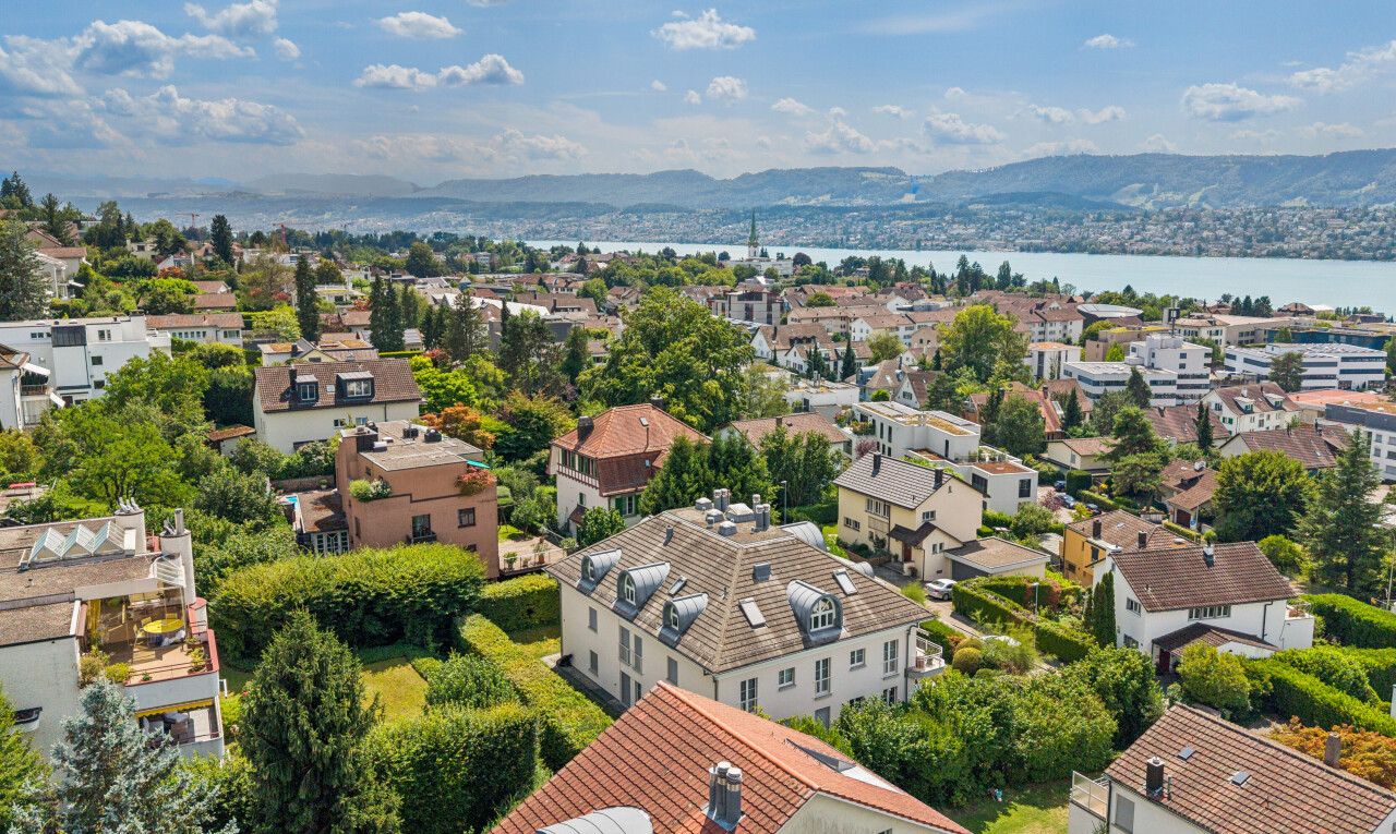 mountain view featuring nearby suburban area and a large body of water