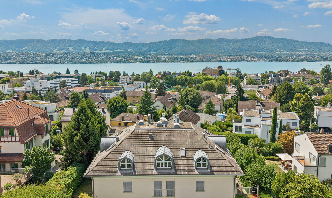 water view featuring mountains and nearby suburban area