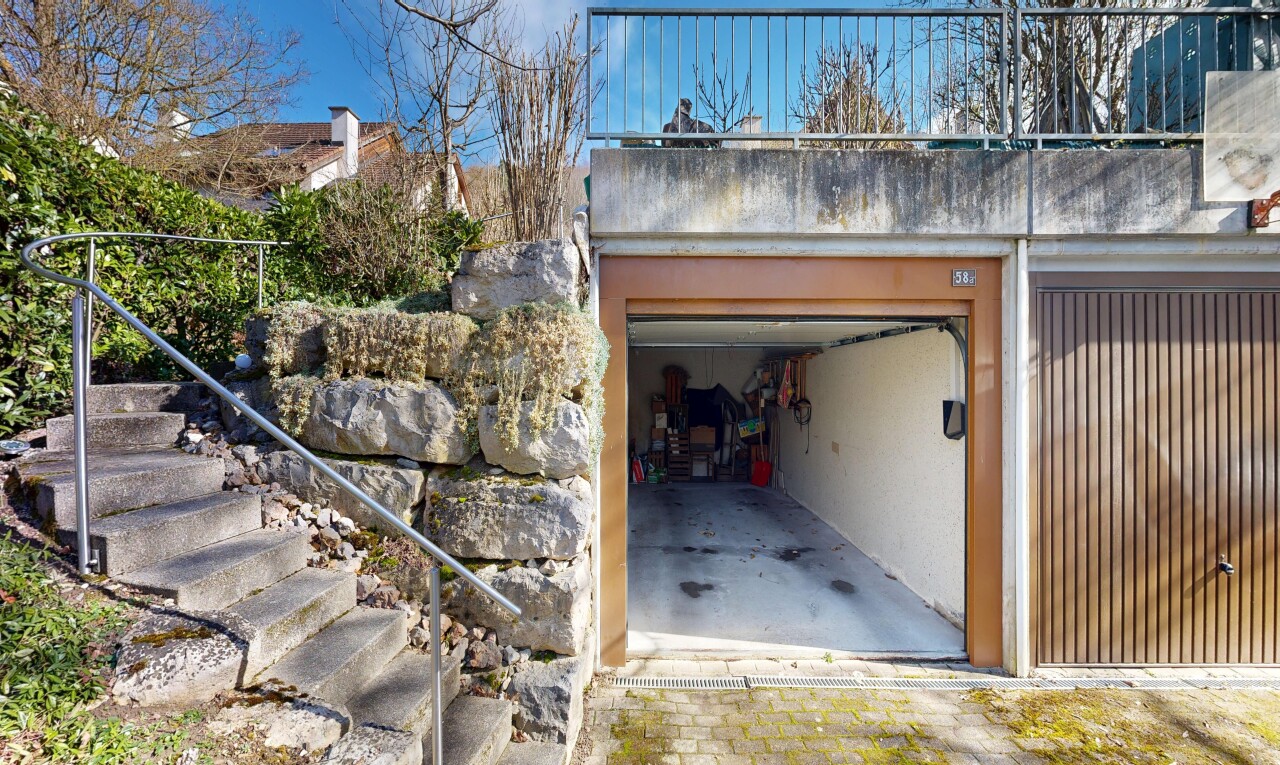 façade avec day time, garage intégré, from property, bardage en stuc, et escaliers
