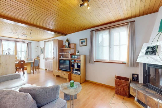 living / dining room featuring wood ceiling, a fireplace, light hardwood / wood-style floors, and rail lighting