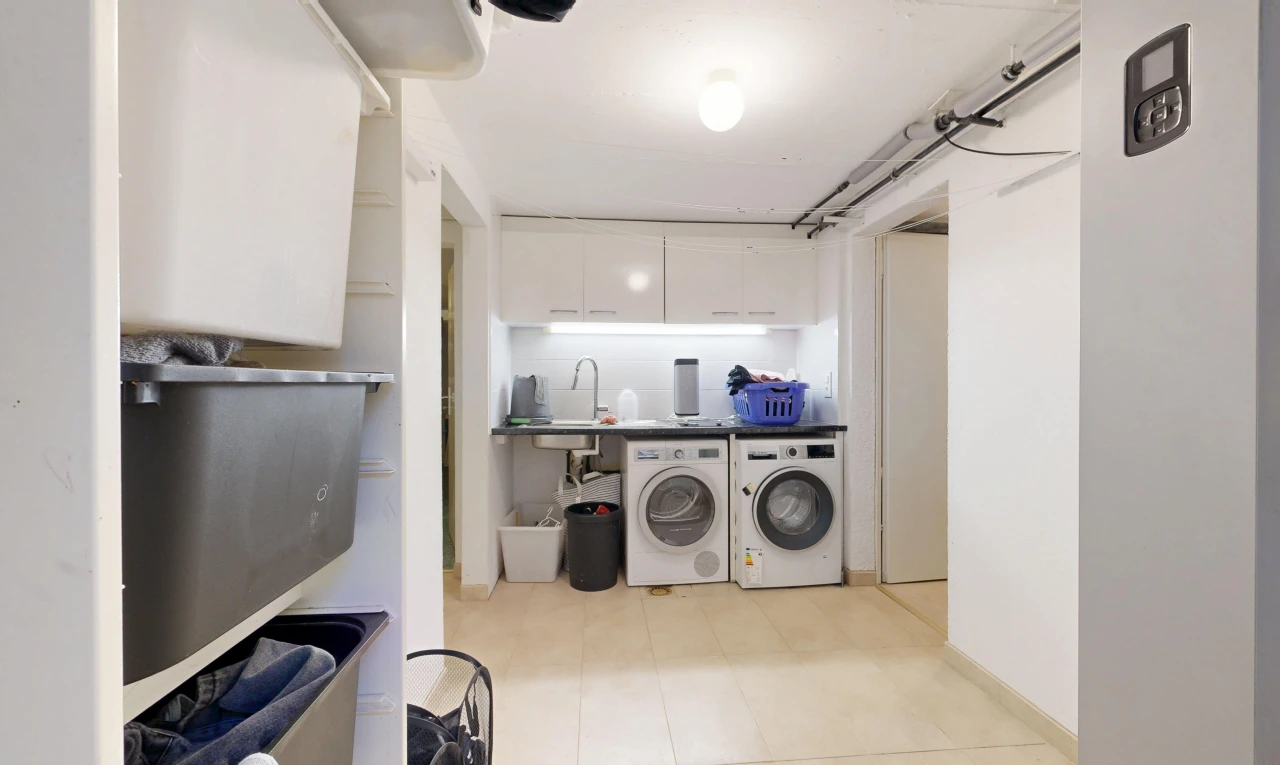 laundry area featuring independent washer and dryer and countertop space