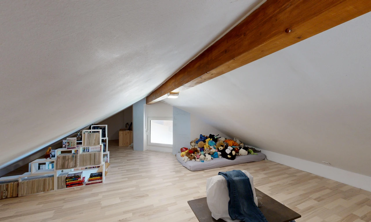 room / bedroom with light wood-type flooring and beamed ceiling