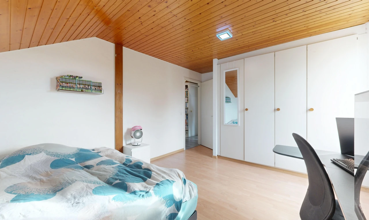 room / bedroom featuring a vaulted wood ceiling, a desk, a closet, and light wood finished floors
