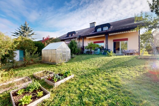 garden with a greenhouse, a vegetable garden, an outbuilding, and a yard
