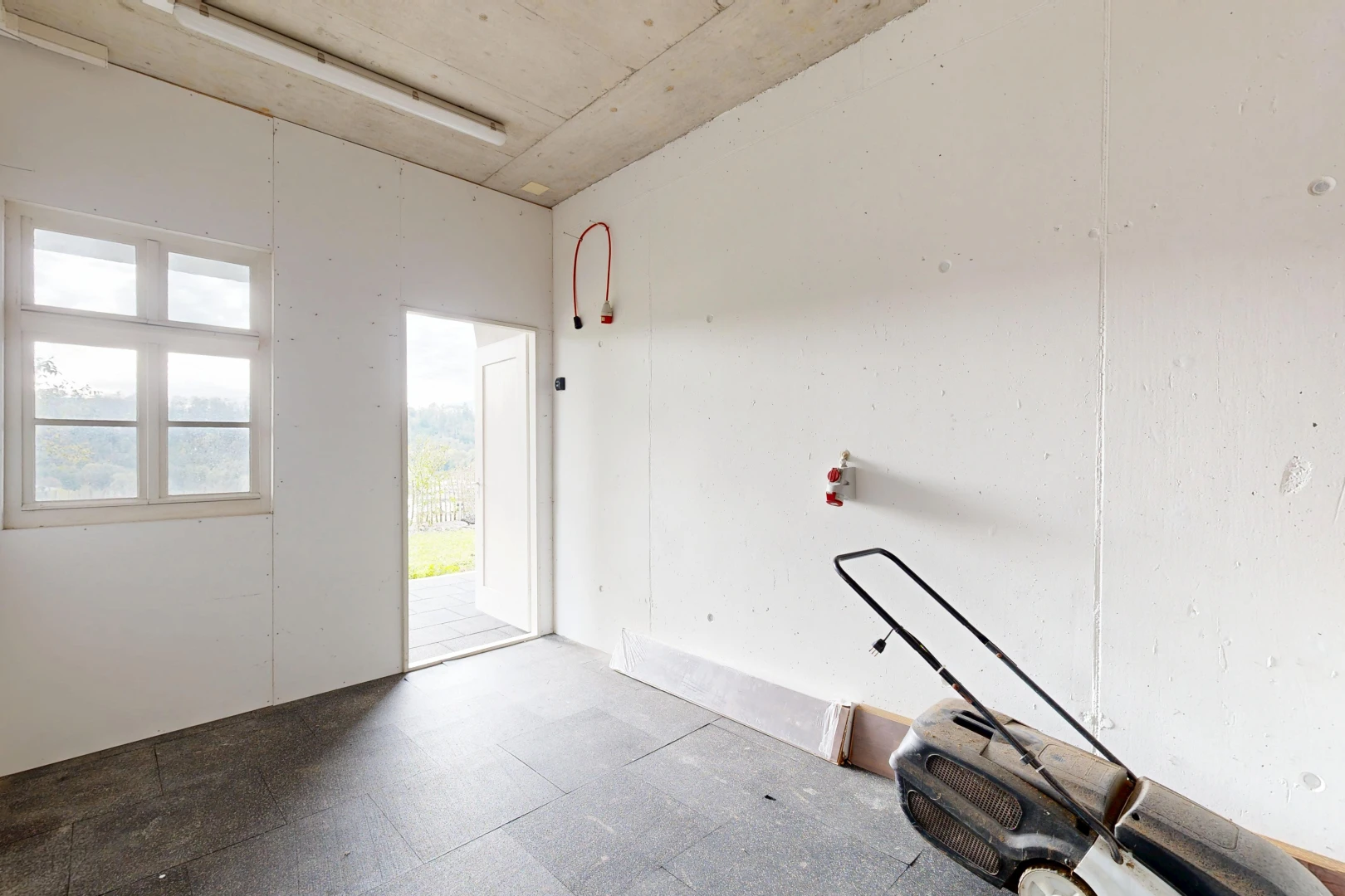 unfurnished room with access to outside