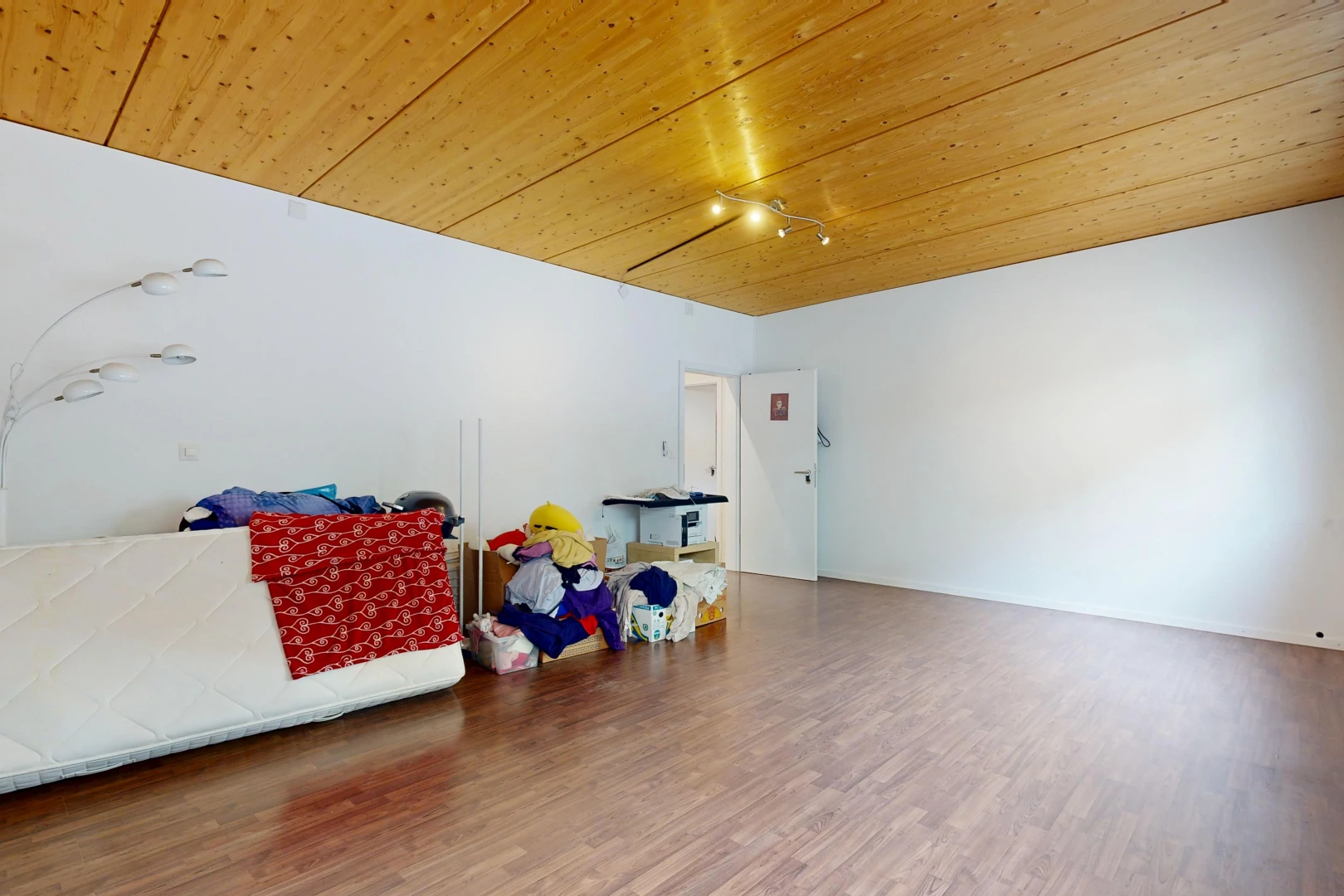 unfurnished room with wooden ceiling, wood finished floors, and track lighting
