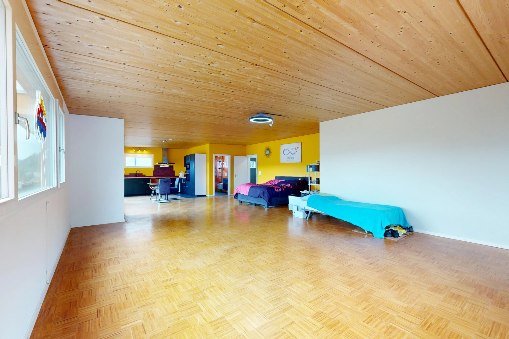 living room with wooden ceiling and parquet floors