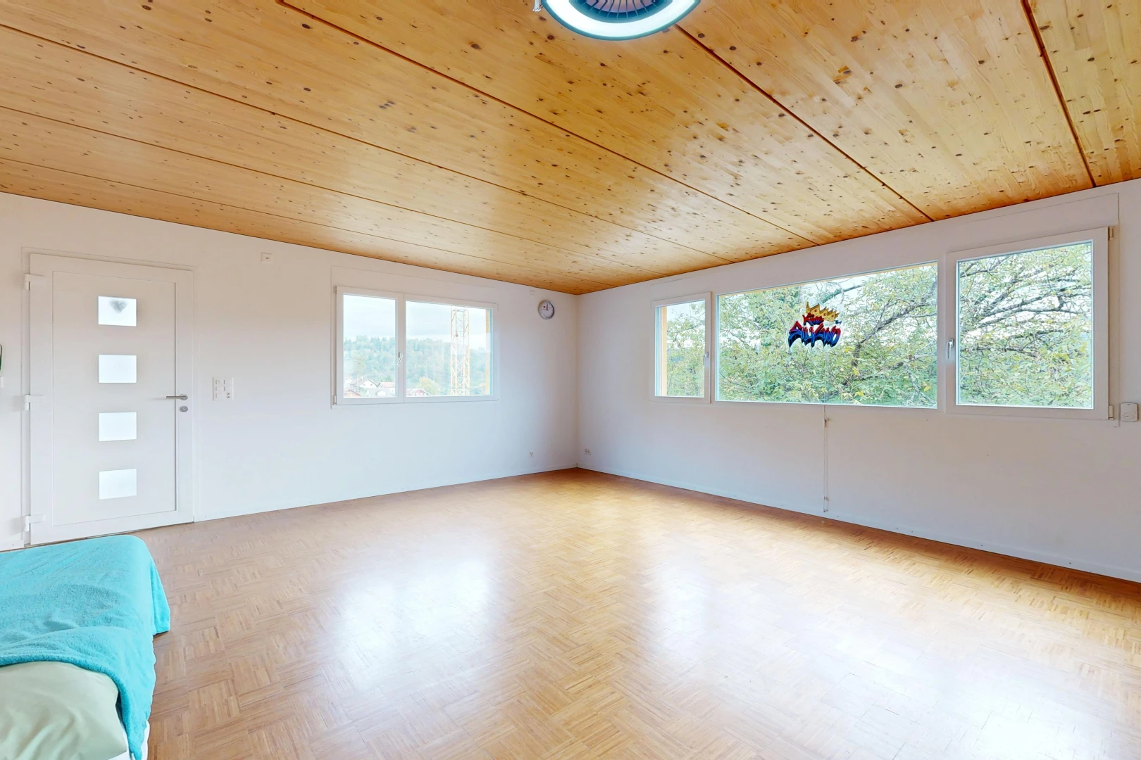 empty room with wooden ceiling, parquet floors, and access to exterior