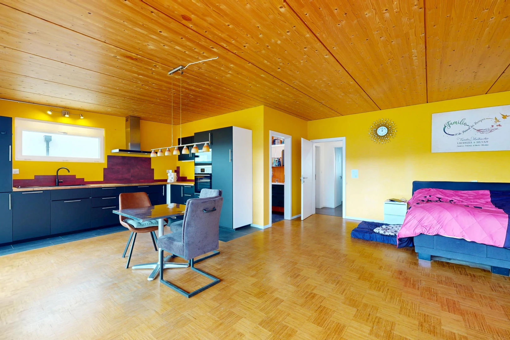 living area with wood ceiling and parquet floors