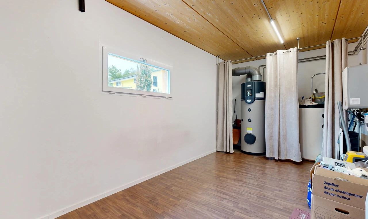 laundry area featuring wooden ceiling, heat pump water heater, wood finished floors, and gas water heater