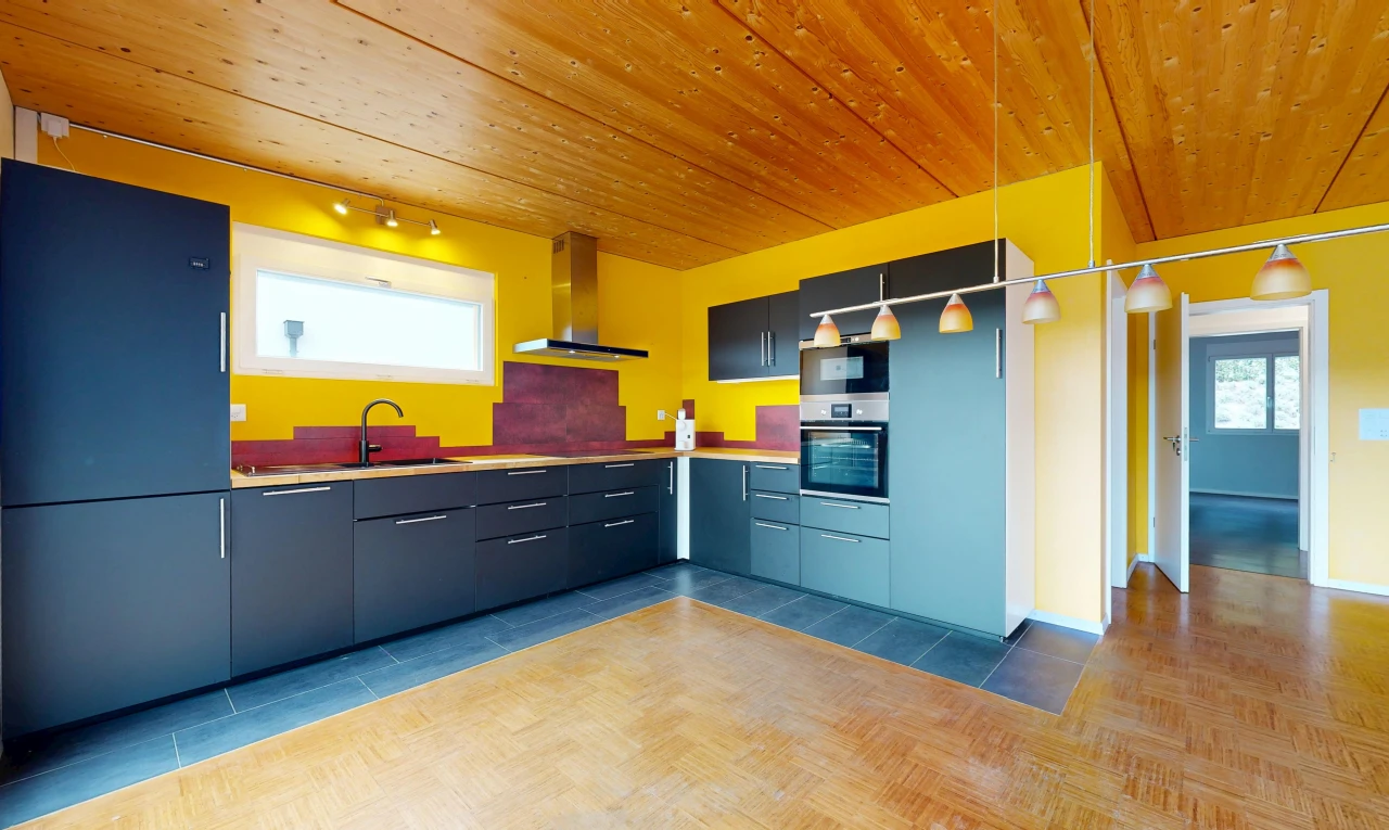 kitchen featuring wooden ceiling, stainless steel oven, light countertops, and track lighting