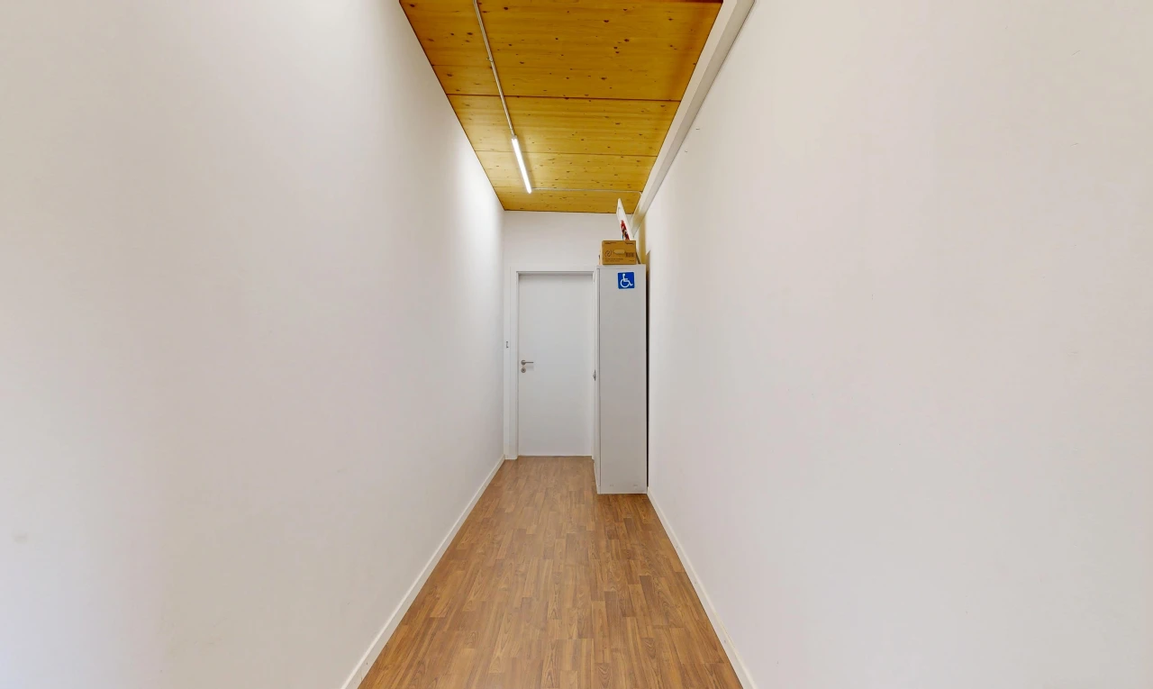 corridor featuring wood ceiling and light wood-style floors