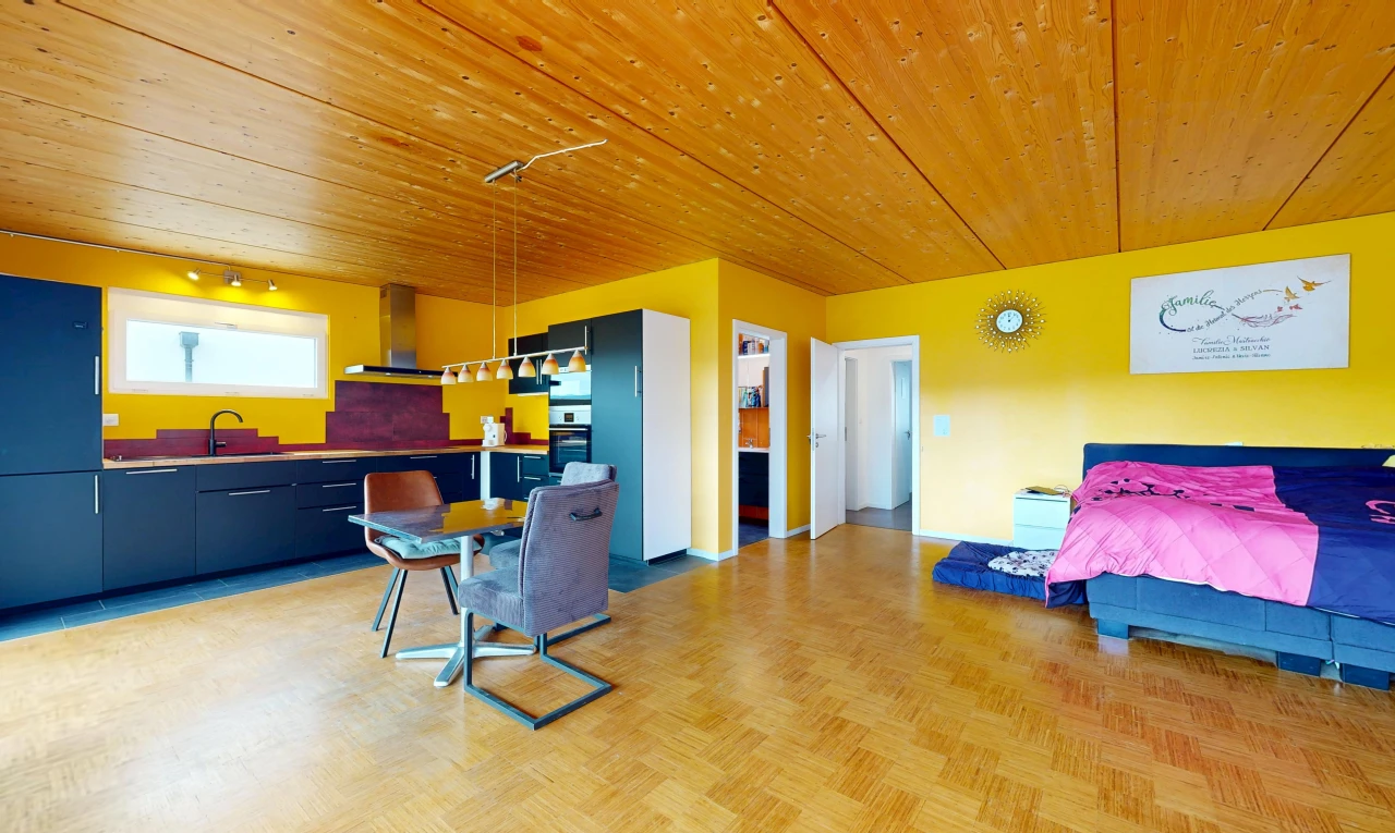 living area with wood ceiling and parquet floors