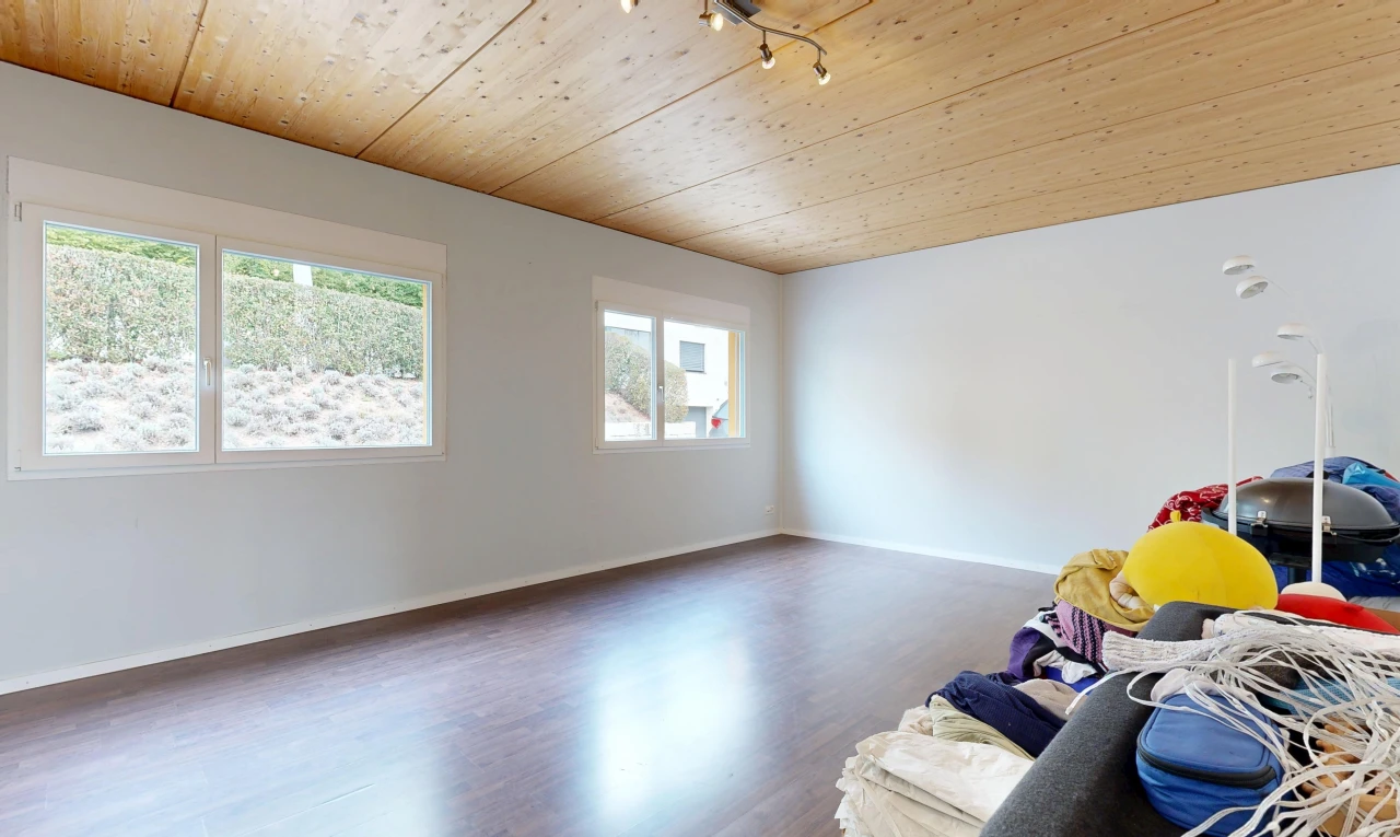 unfurnished room with wood ceiling, wood finished floors, and track lighting