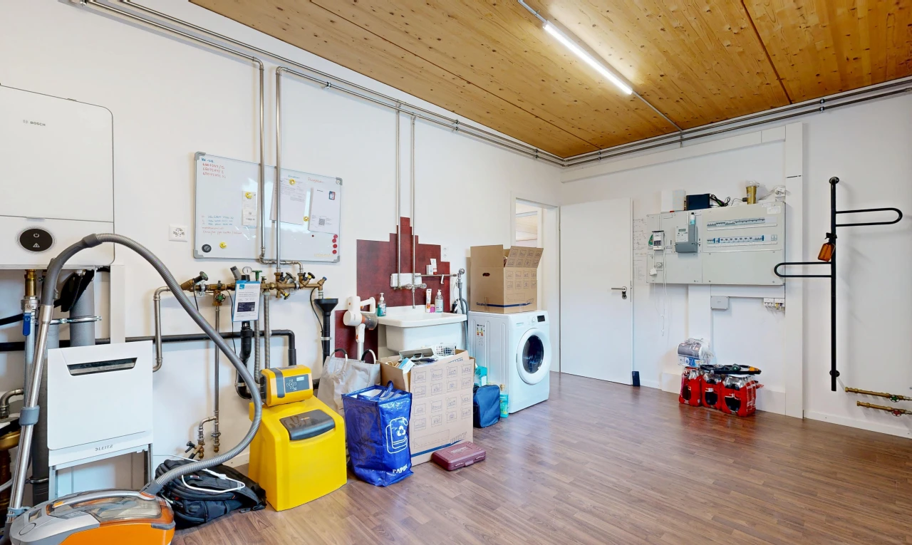 laundry area featuring washer / clothes dryer and a sink
