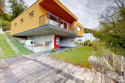 view of home with a balcony and stucco siding