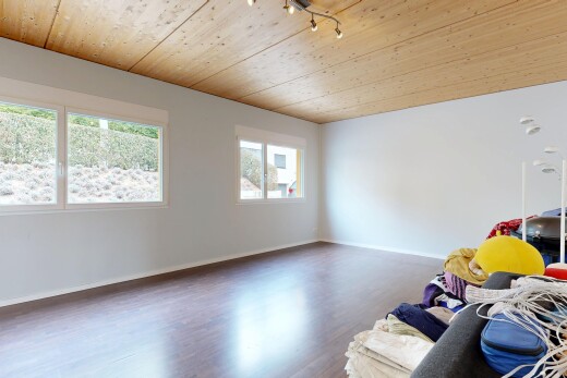 unfurnished room with wood ceiling, wood finished floors, and track lighting