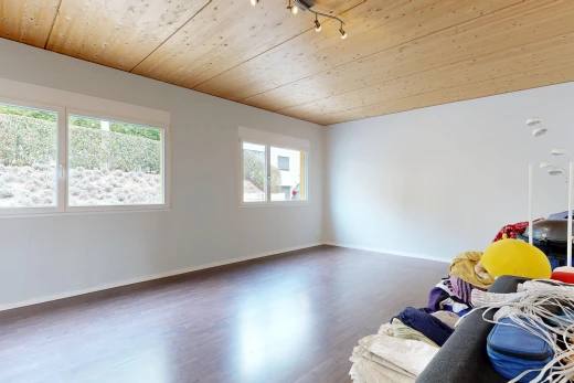 unfurnished room with wood ceiling, wood finished floors, and track lighting
