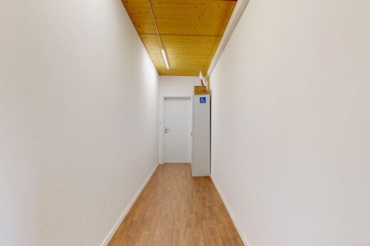 corridor featuring wood ceiling and light wood-style floors