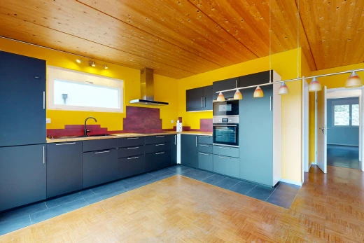 kitchen featuring wooden ceiling, stainless steel oven, light countertops, and track lighting