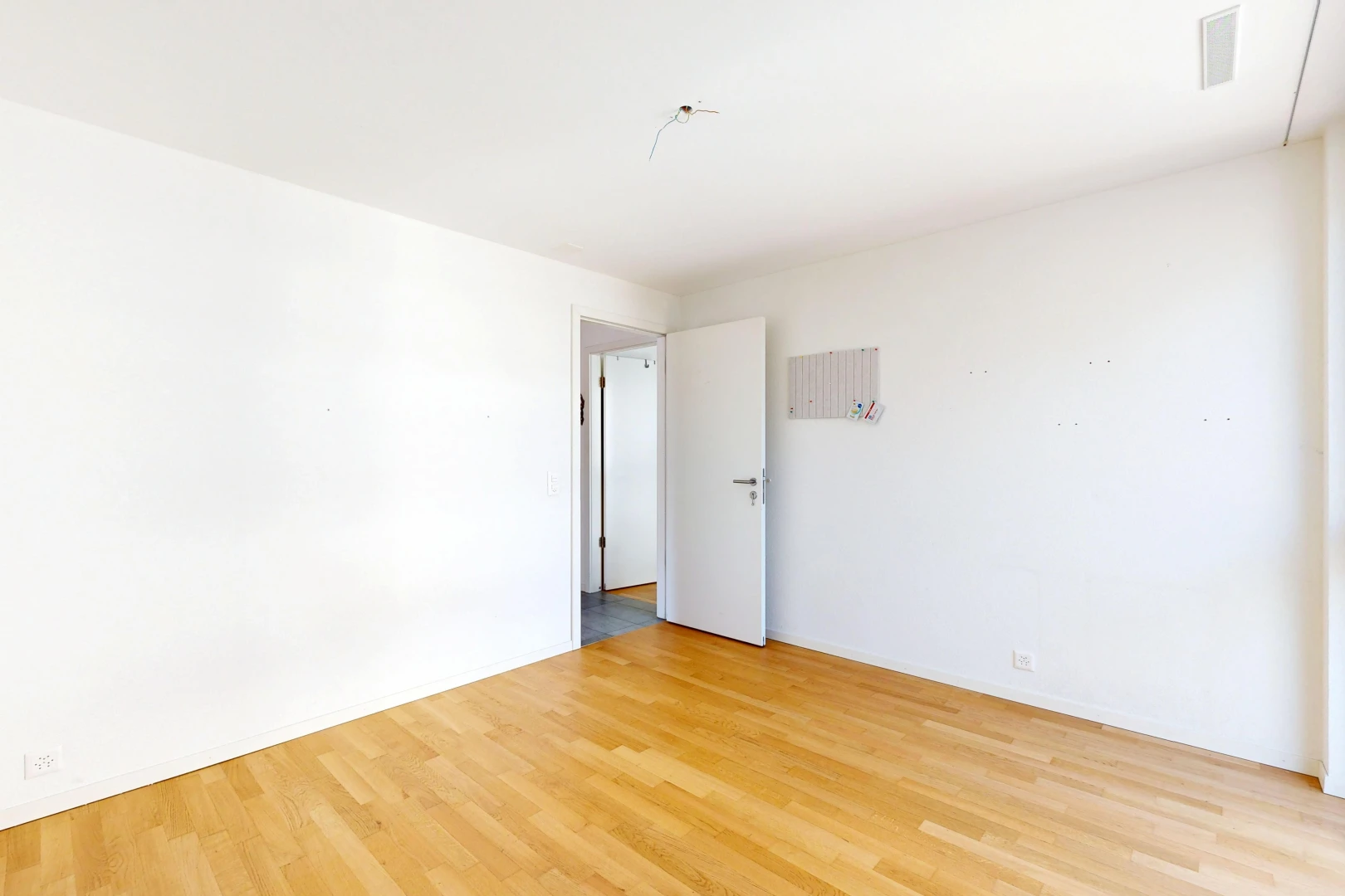 spare room featuring light wood finished floors
