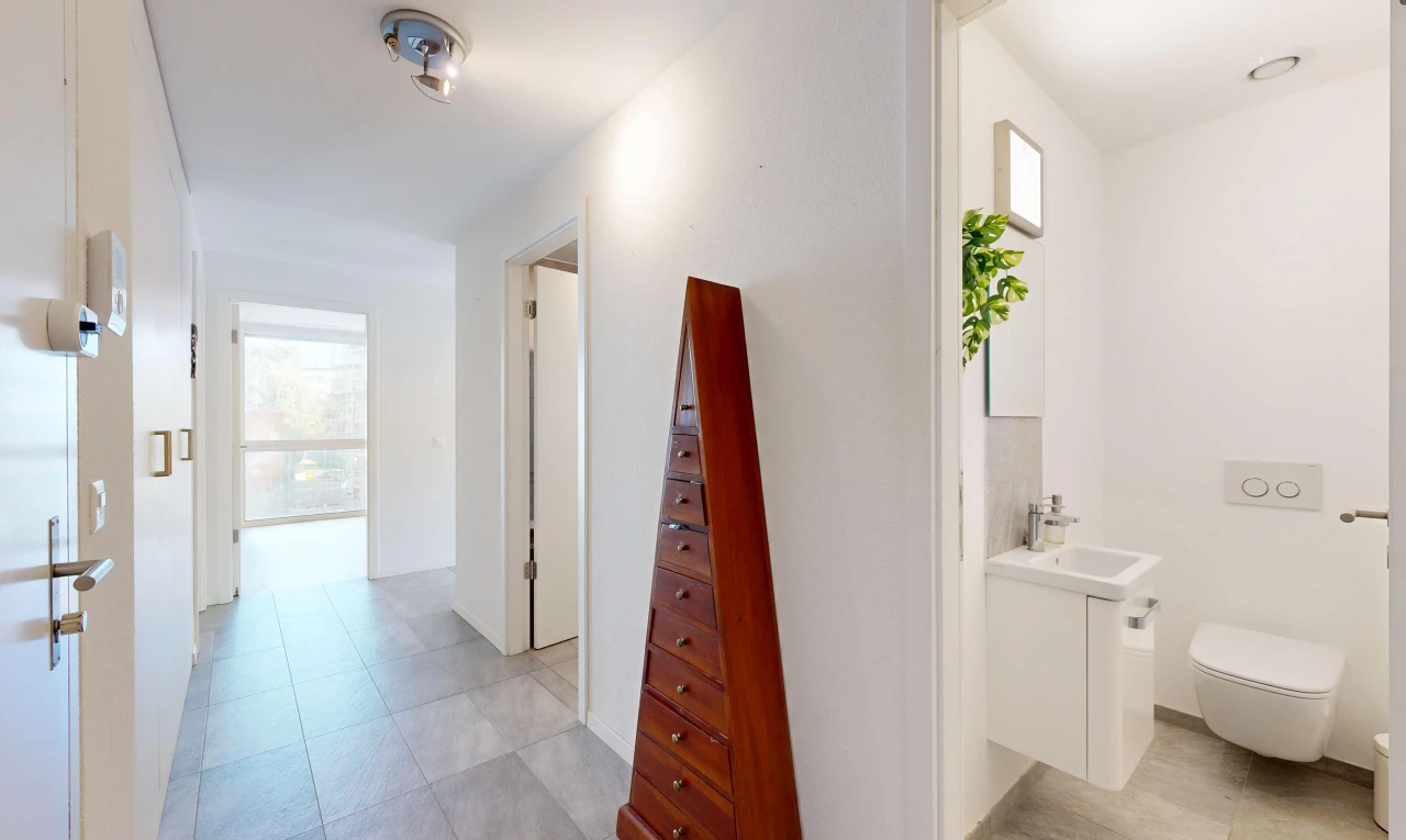 corridor featuring a sink