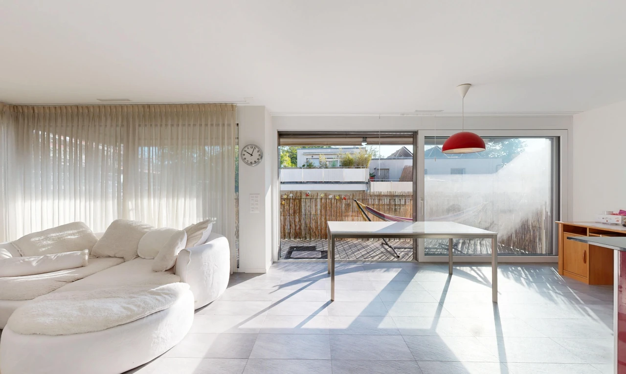 living room with hanging light fixtures, access to outside, and light tile patterned floors