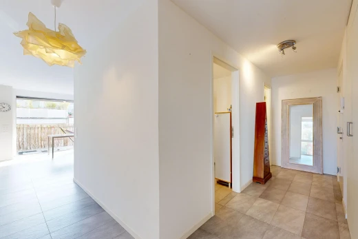 hall with light tile patterned flooring