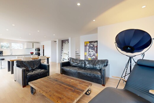 living room with light wood finished floors and recessed lighting