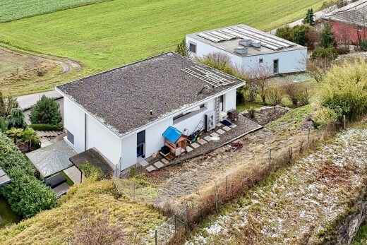 view of home with stucco siding, a patio area, and a rural view