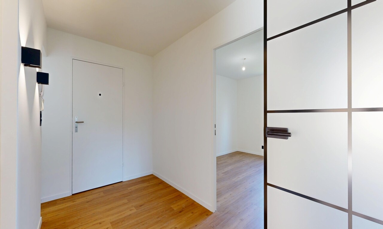 empty room featuring light wood-style flooring and baseboards