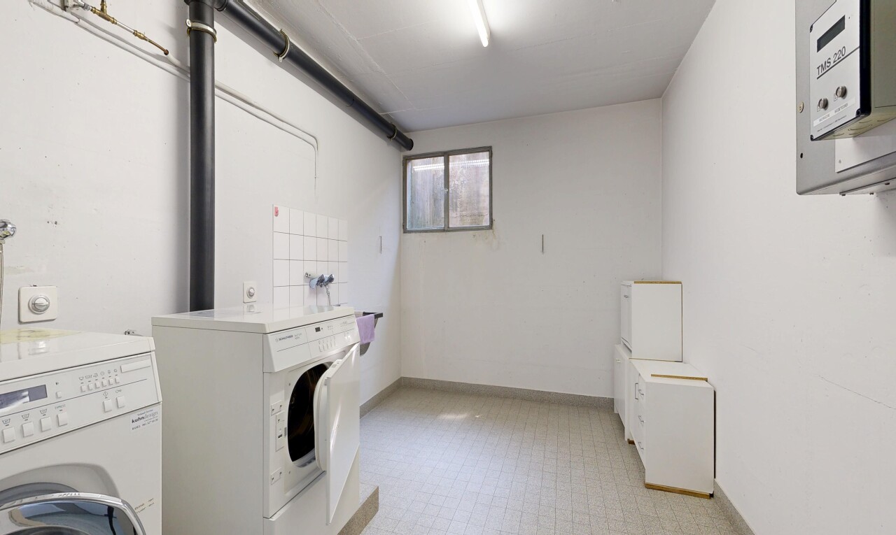 laundry room with light flooring and separate washer and dryer