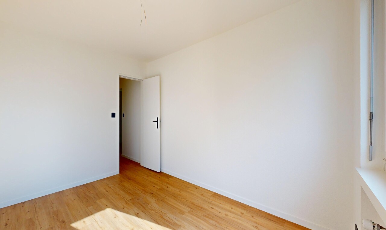 unfurnished room featuring light wood-style floors and baseboards