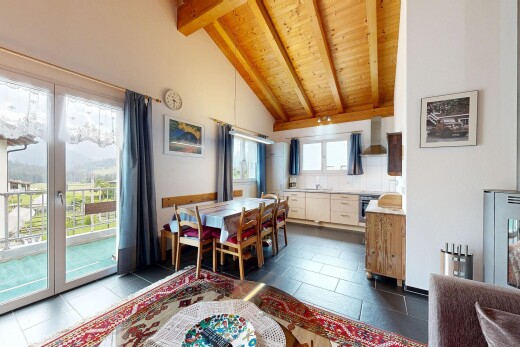 esszimmer mit inside property, dark floor, küchenrückwand beim Herd, balkendecke, und beamed ceiling