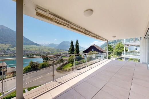 balcony with a water and mountain view