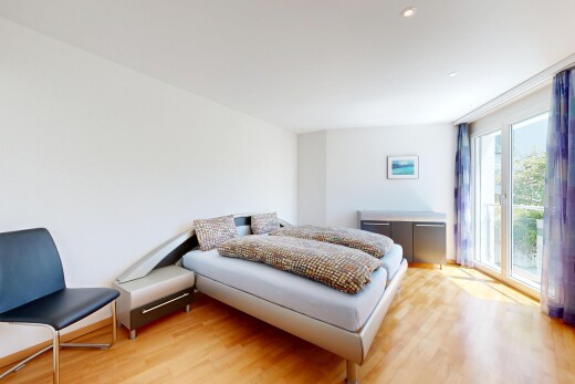 room / bedroom featuring light wood finished floors and access to exterior