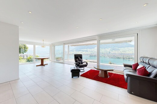 workout area with floor to ceiling windows and a water view
