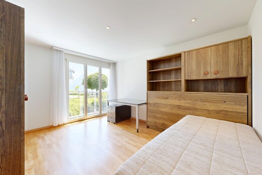 room featuring light wood-style floors, an office area, and recessed lighting