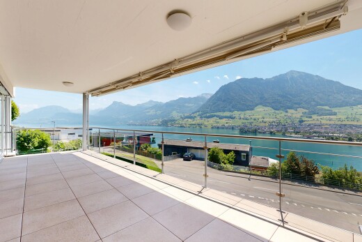 balcony featuring a water and mountain view