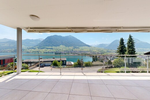 balcony with a water and mountain view