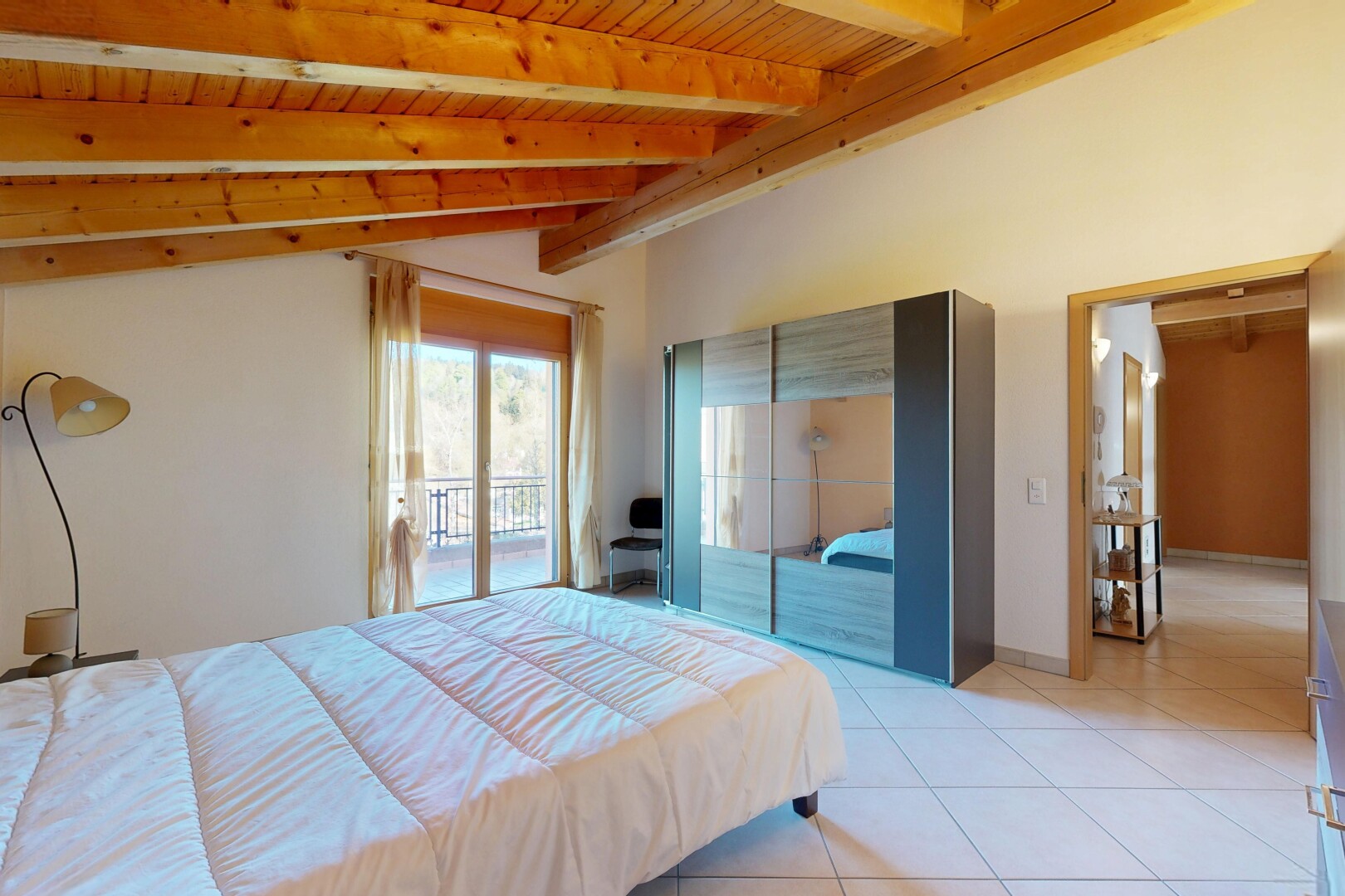 room featuring access to outside, vaulted ceiling with beams, wood ceiling, and light tile patterned floors