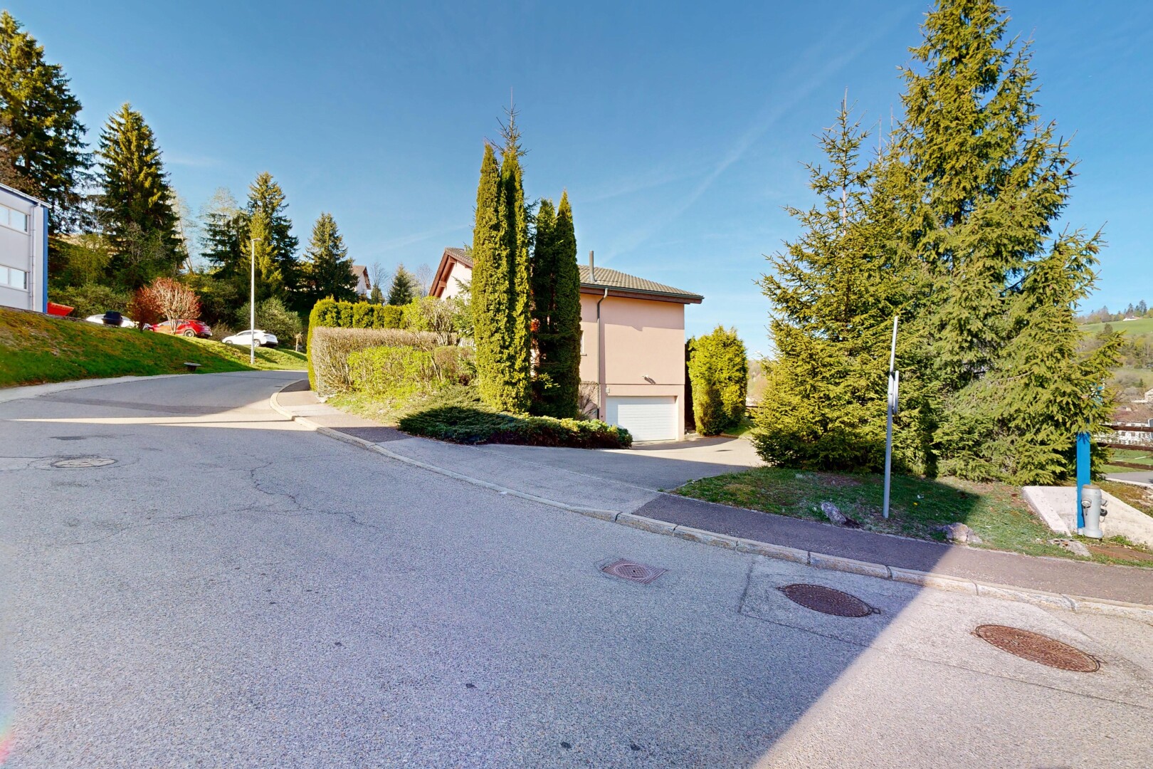 outdoor house featuring a garage and driveway