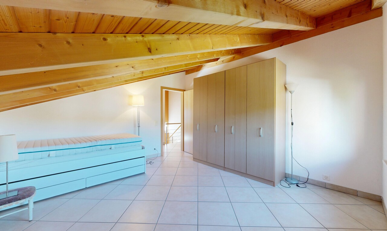 unfurnished room featuring a vaulted wooden ceiling and light tile patterned floors