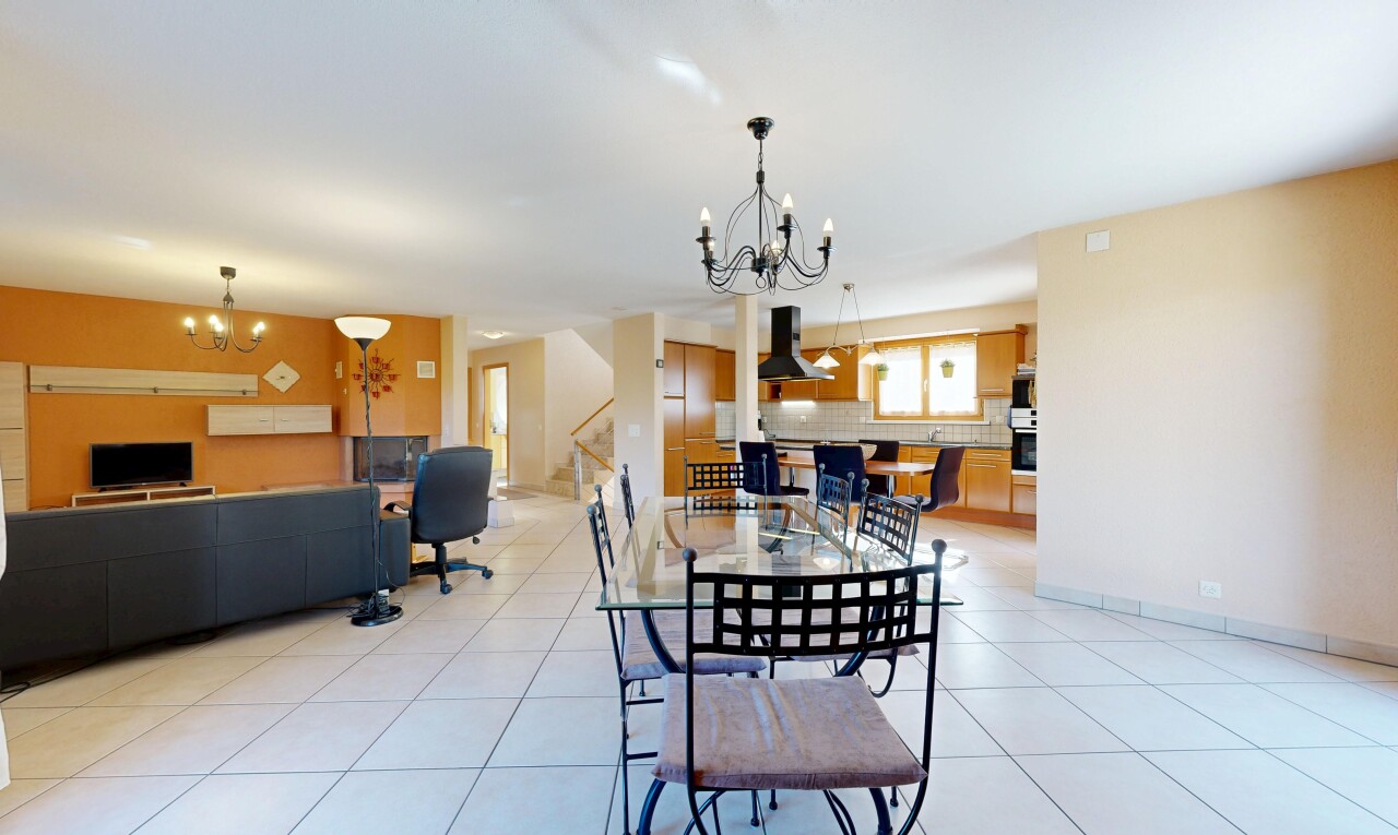 dining room with a chandelier and light tile patterned floors