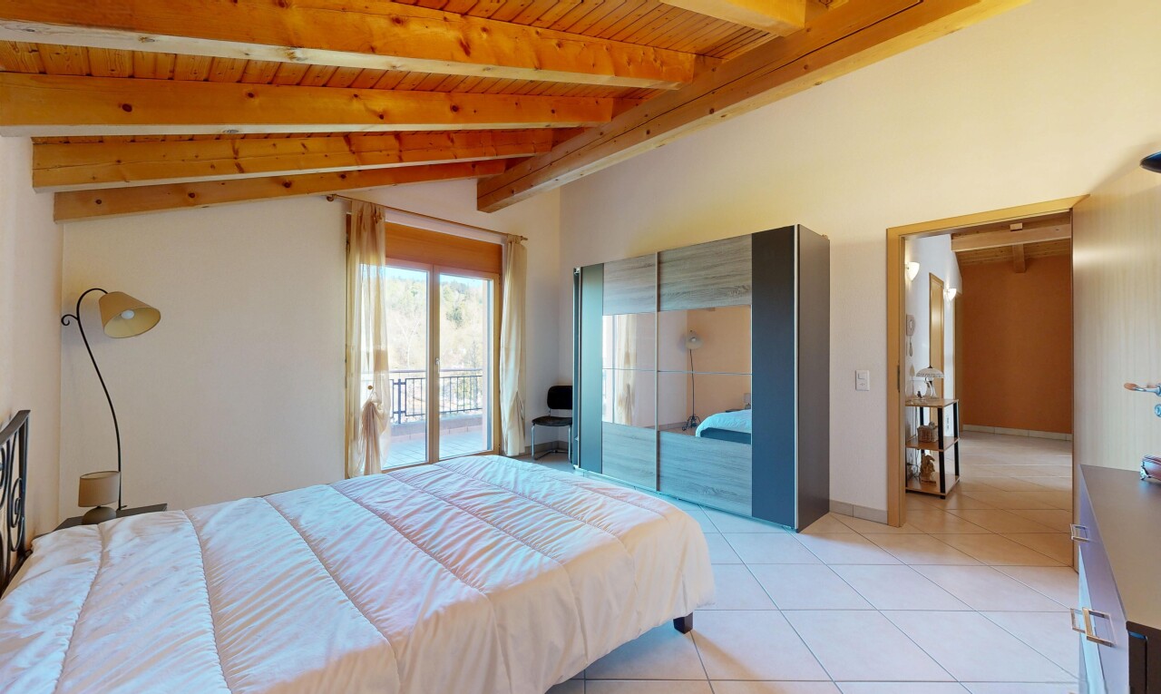 room featuring access to outside, vaulted ceiling with beams, wood ceiling, and light tile patterned floors