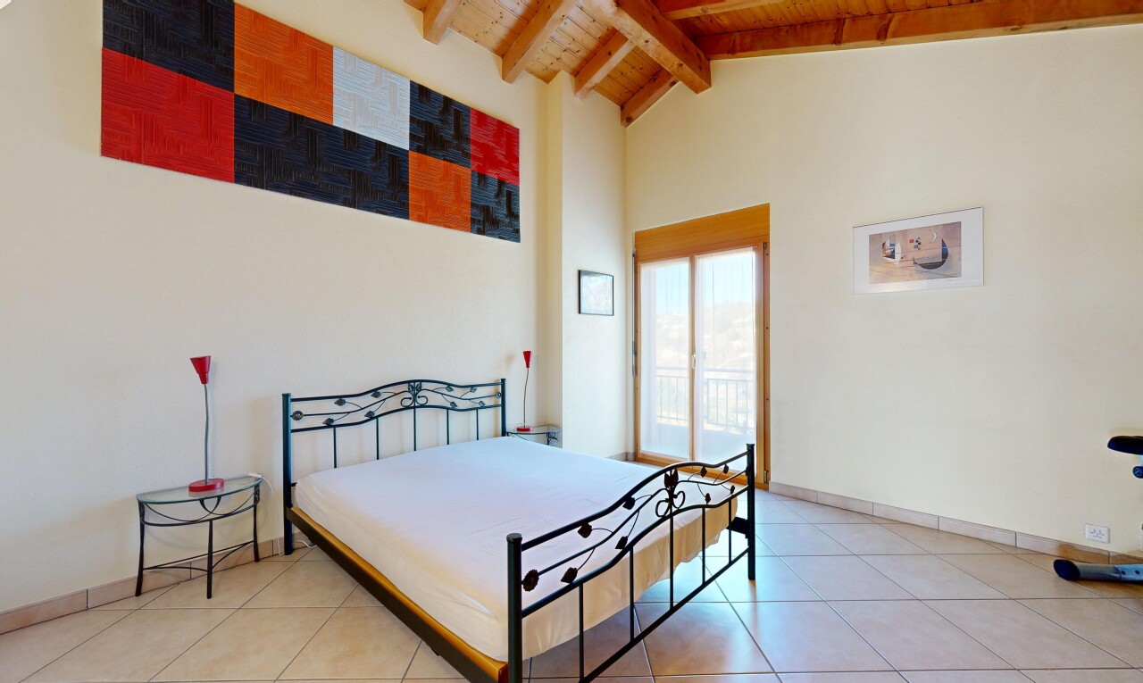 room featuring a high wood beamed ceiling, access to outside, and light tile patterned flooring