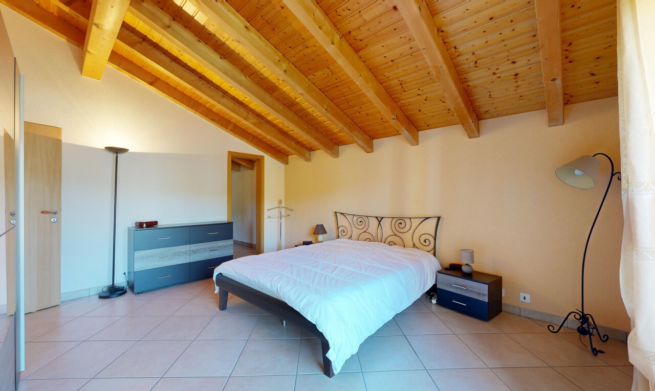 room featuring vaulted ceiling with beams, wooden ceiling, and light tile patterned flooring