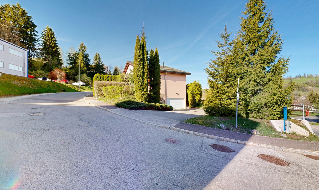 outdoor house featuring a garage and driveway
